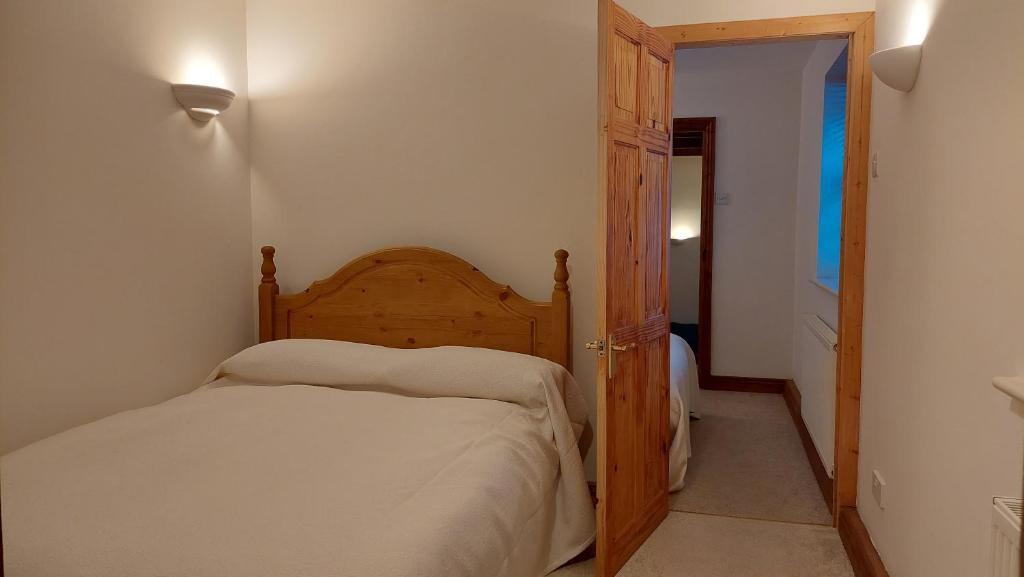Bedroom at The Barn looking out over the thatched roof